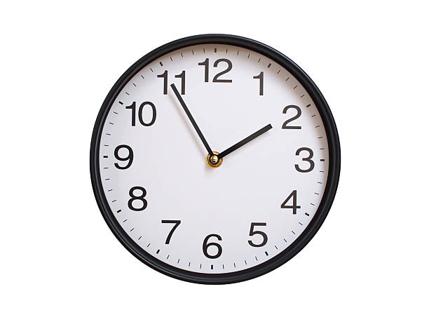 Round wall clock showing 01:55 or 13:55 isolated on white background. Concept of time, punctuality, deadline, or beginning of a new day.