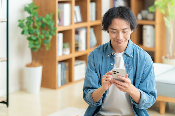 istock young man relaxing in his room 2243934534