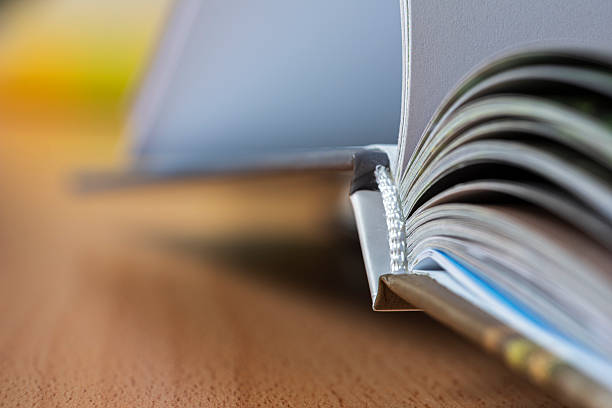 istock Hardcover open book lying on a desk, object with selective focus, in perspective 2243935300