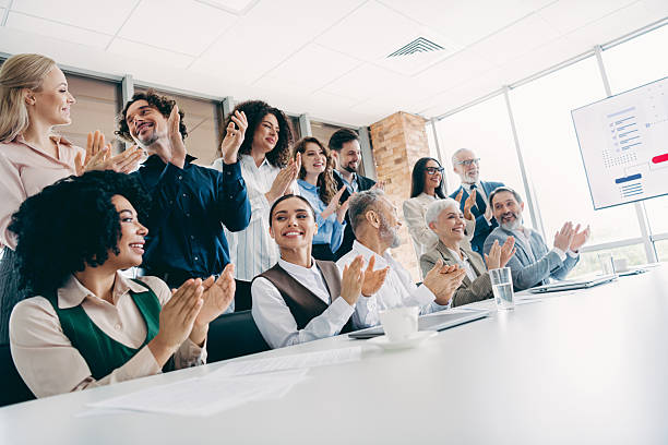 istock Team celebration in a modern office setting showcasing diversity and collaboration during a successful professional meeting 2243935393