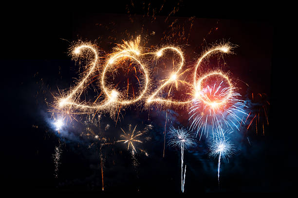 istock Sparkler Happy New Year 2026 with fireworks 2243935416