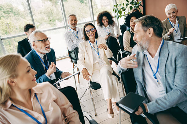 istock Diverse workplace team engaged in an interactive business meeting together at a modern office setting, promoting teamwork. 2243935689