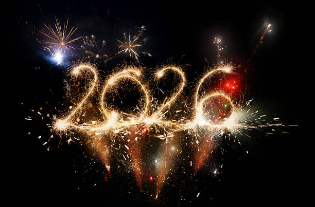 istock Sparkler Happy New Year 2026 with fireworks 2243935862