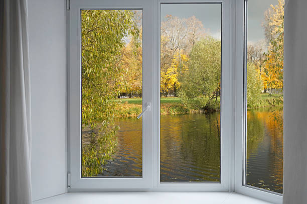 istock Window frame, view from the window  on yellow trees, landscape with autumn forest. 2243936285