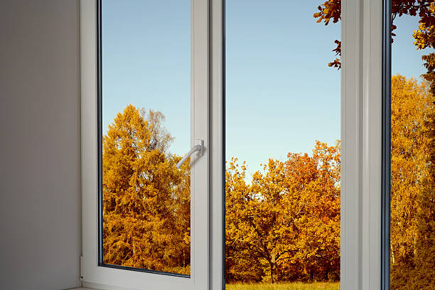 istock Window frame, view from the window  on yellow trees, landscape with autumn forest. 2243936310