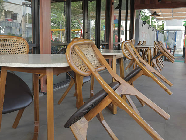 istock wooden cafe tables and chairs 2243938147