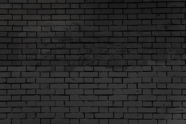 istock Brick wall with faded blue graffiti. 2243938153
