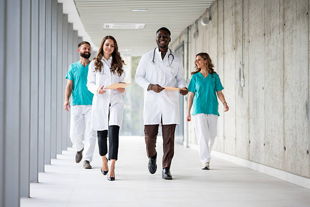 istock Diverse medical team walking in hospital corridor 2243938513