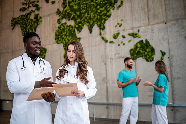 istock Diverse doctors collaborating on global health initiative 2243940739