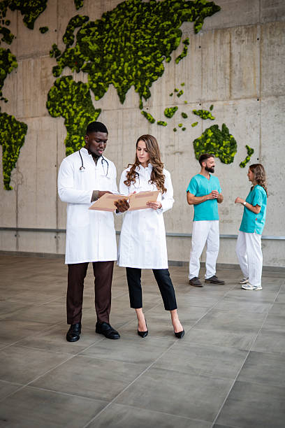 istock Medical professionals discussing global health strategy documents 2243940797