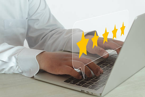 istock Customer Feedback: User Giving 4 Star Rating on Laptop Survey 2243940986