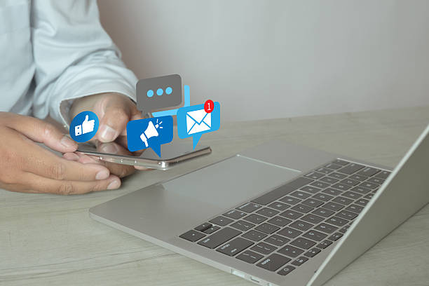 istock Digital Marketing and Business Communication Concept with Man Using Smartphone and Laptop 2243941191