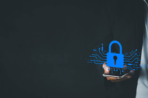 istock Cybersecurity and Data Protection Concept with Businessman Holding Smartphone with copyspace or freespace. 2243941274