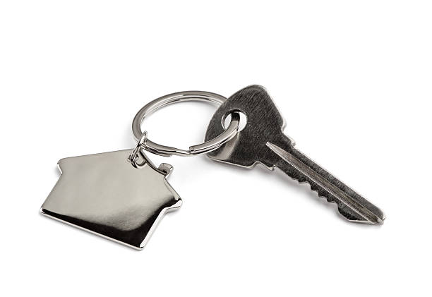 istock Key of house isolated on white 2243941463