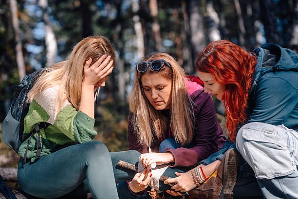 istock Women providing first aid for hiking injury in forest 2243942013