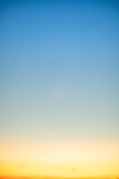istock Beautiful , luxury soft gradient orange gold clouds and sunlight on the blue sky perfect for the background, take in evening,Twilight, Large size, high definition landscape photo,Vertical 2243943782
