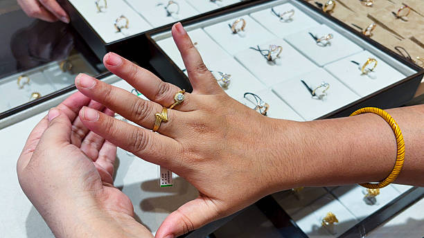 istock hand modeling fashionable gold ring stack combination with minimalist and floral designs 2243944448