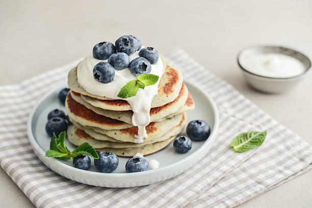 istock Plate blueberry pancakes with sour cream 2243944619