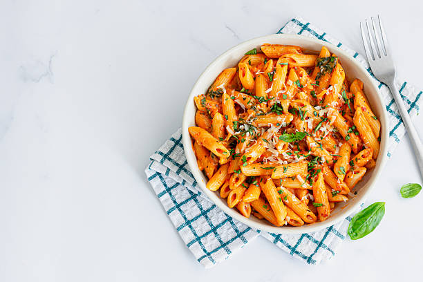istock Tomato Sauce Penne Pasta Directly Above Photo 2243944620