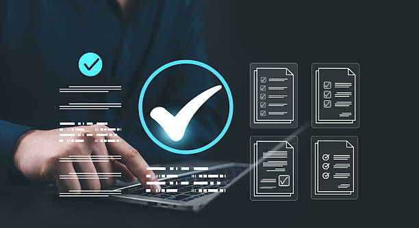 istock Businessman using laptop with digital checklist and large check mark icon, symbolizing task completion, productivity, workflow automation, and online project management technology. 2243947444