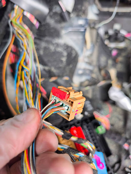 istock Mechanic holding oxidized wiring connector from vehicle electrical system 2243949417