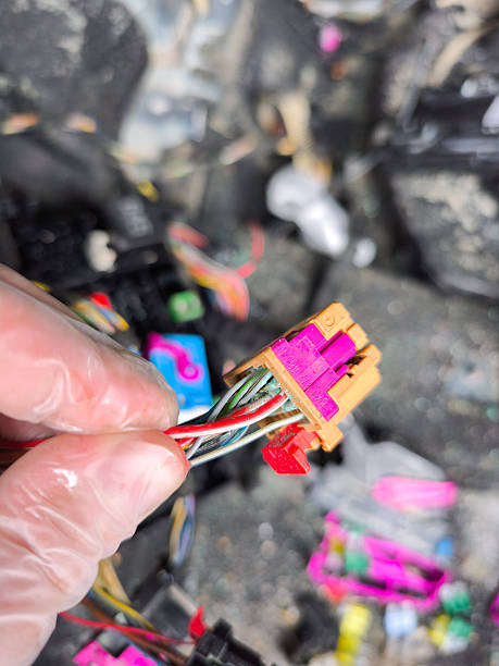 istock Mechanic holding oxidized wiring connector from vehicle electrical system 2243949428