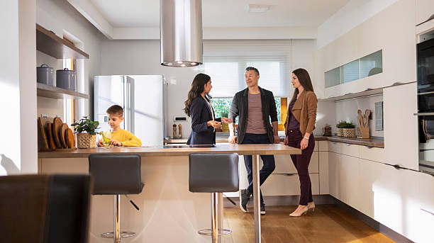 istock Real estate agent showing modern kitchen to couple 2243952055