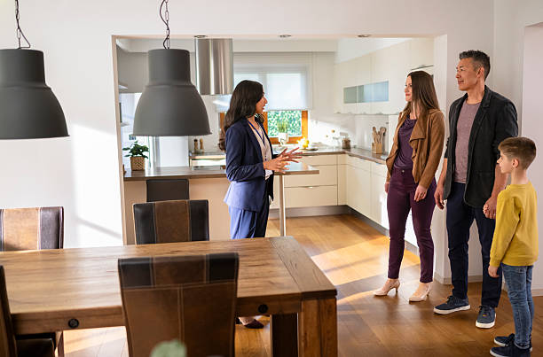 istock Estate agent talking with family 2243952058