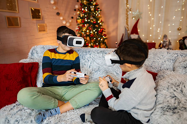 istock Boys playing virtual reality video game on Christmas 2243952119