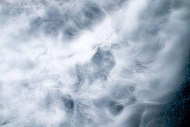 istock White steam or smoke swirling over a blue background, creating a soft and dreamy abstract texture. Perfect for backgrounds, design concepts, spa, relaxation, and natural atmosphere themes. 2243952362