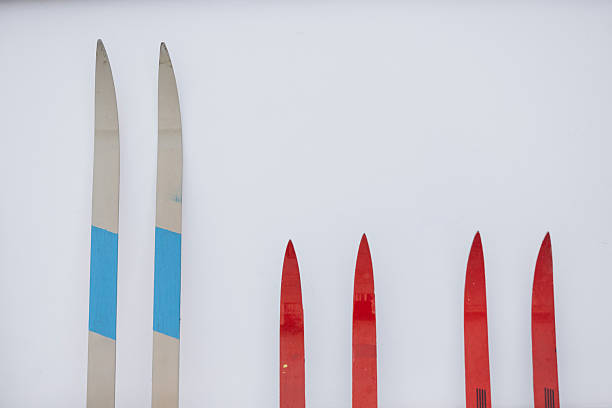 ski poles and skis on a snowy slope on a sunny day