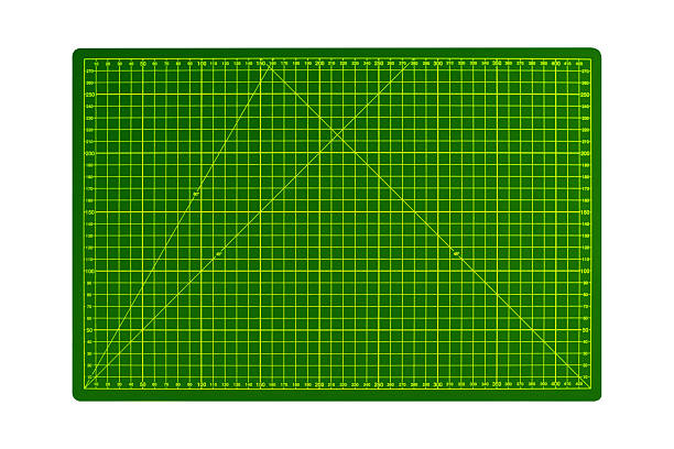 istock Green A3 cutting mat with yellow measurement grid is isolated. 2243960356