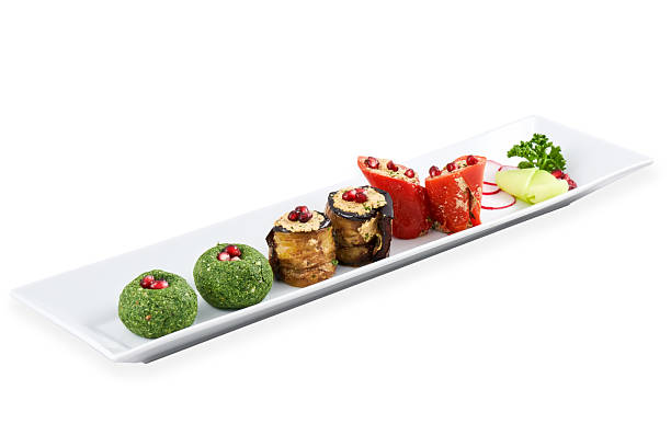 istock Colorful gourmet dish featuring assorted delicacies on a long white plate w.. 2243961208