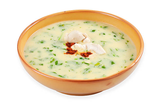 istock Creamy soup with herbs and chicken pieces served in a rustic bowl for a com.. 2243961298