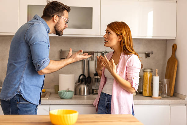 istock couple is having argument in the kitchen during breakfast. The scene reflects a moment of frustration and conflict, with both individuals visibly upset in a home setting. disagreement in everyday life 2243961517