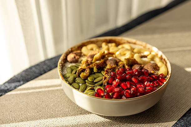 Healthy Nut and Fruit Bowl with Walnuts, Pomegranate, Figs, and Cashews