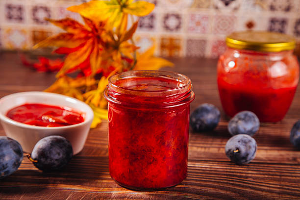 Homemade plum jam and fresh organic plums