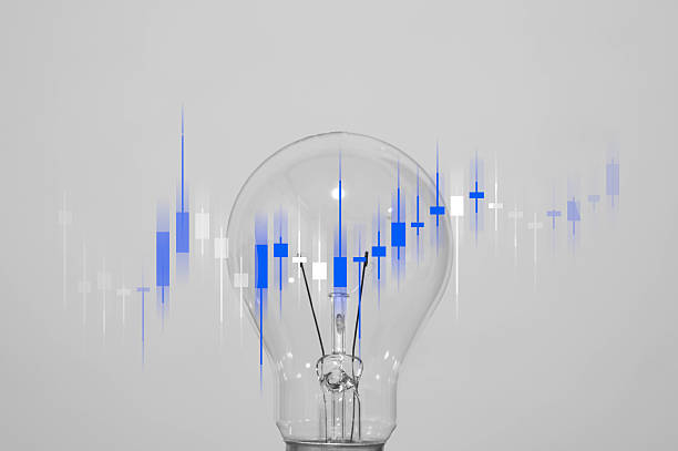 istock A glowing light bulb with candlestick chart overlay symbolizes financial insight, stock trading strategy, and innovative investment ideas. 2243966409