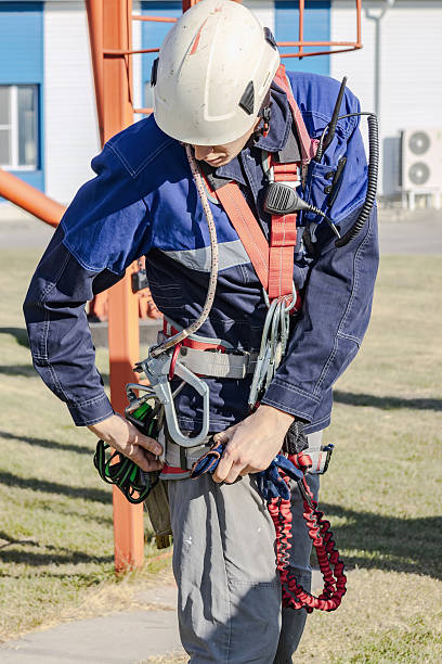 istock Safety Training for Workers in Harness and Climbing Gear 2243972491