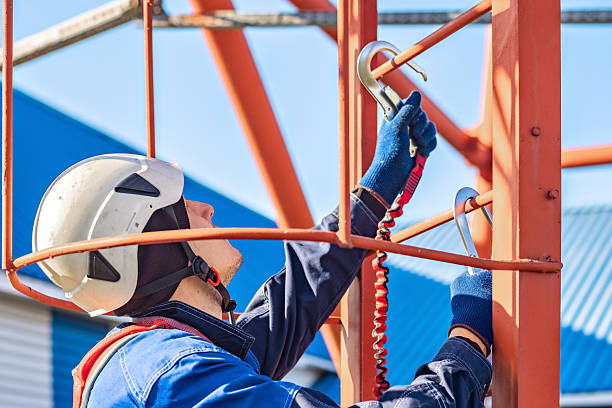 istock Worker Installing Equipment on Construction Site with Safety Gear 2243972883