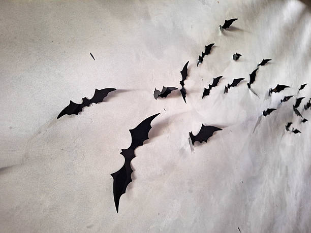 Flying black bats over background. Halloween Decoration.