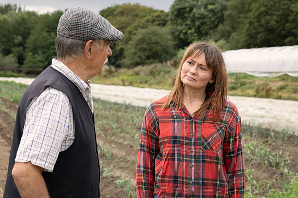 istock A male and female farmer chatting on a farm 2243975430