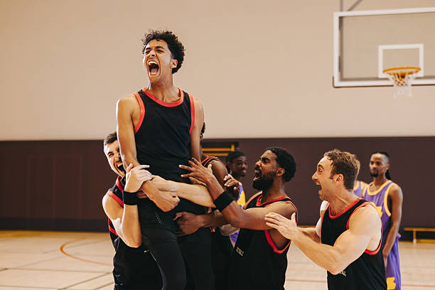 istock Final buzzer joy: Men's basketball team celebrates hard-earned win 2243975487