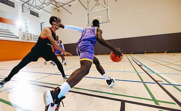 istock Fast break fury: Guard speeds up the floor 2243975768