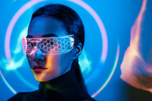 istock Futuristic woman wearing illuminated augmented reality glasses 2243979855