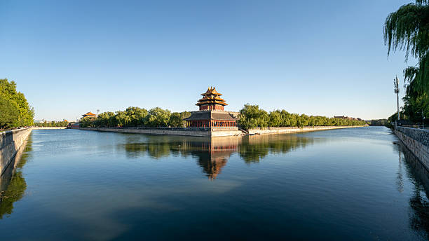 istock Magnificent ancient Chinese architectural corner tower with clear water reflection 2243987782