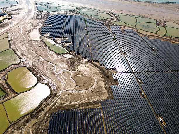 istock Solar panels on water, farmland and roads 2243989236