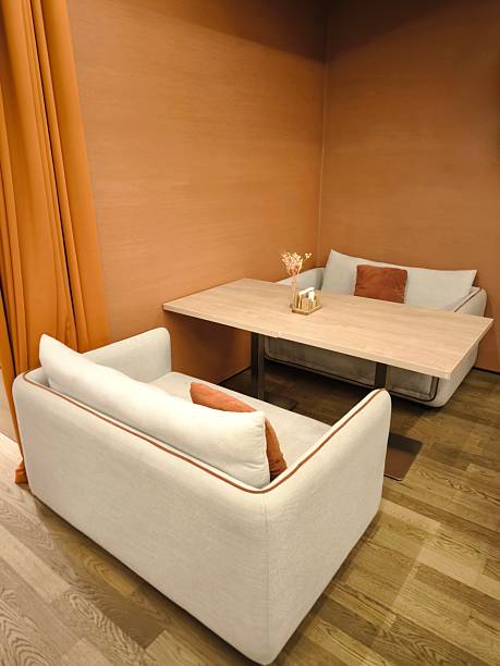 istock The restaurant's cozy interior features soft sofas and a wooden table. 2243989324