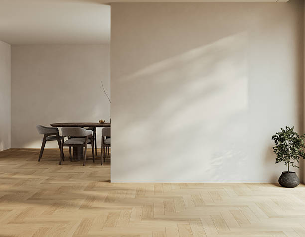 istock Minimal empty interior with herringbone oak flooring, beige walls, and soft natural light creating calm shadows. 3D rendering 2243989997