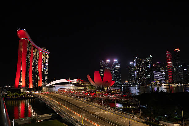 31 December 2024, Marina Bay - Singapore.Singapore’s Downtown Core glows at night, with skyscrapers and city lights reflecting the energy, modernity, and vibrant urban life of the city.